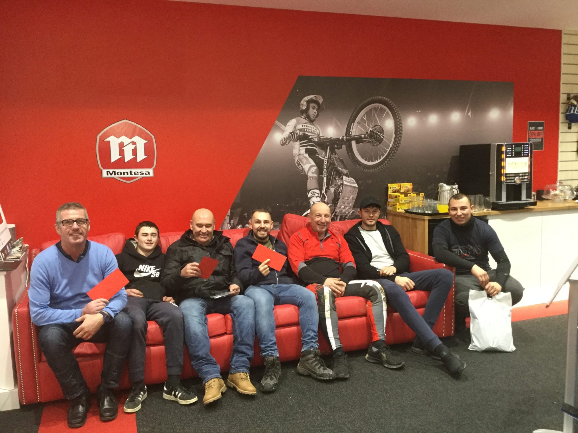 a group of people sitting posing for the camera