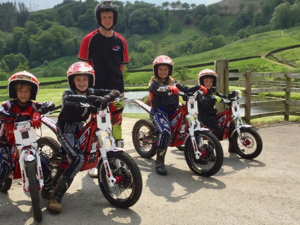 a group of people riding on the back of a motorcycle