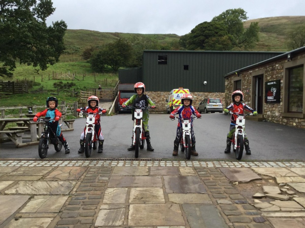 a group of people riding on the back of a motorcycle