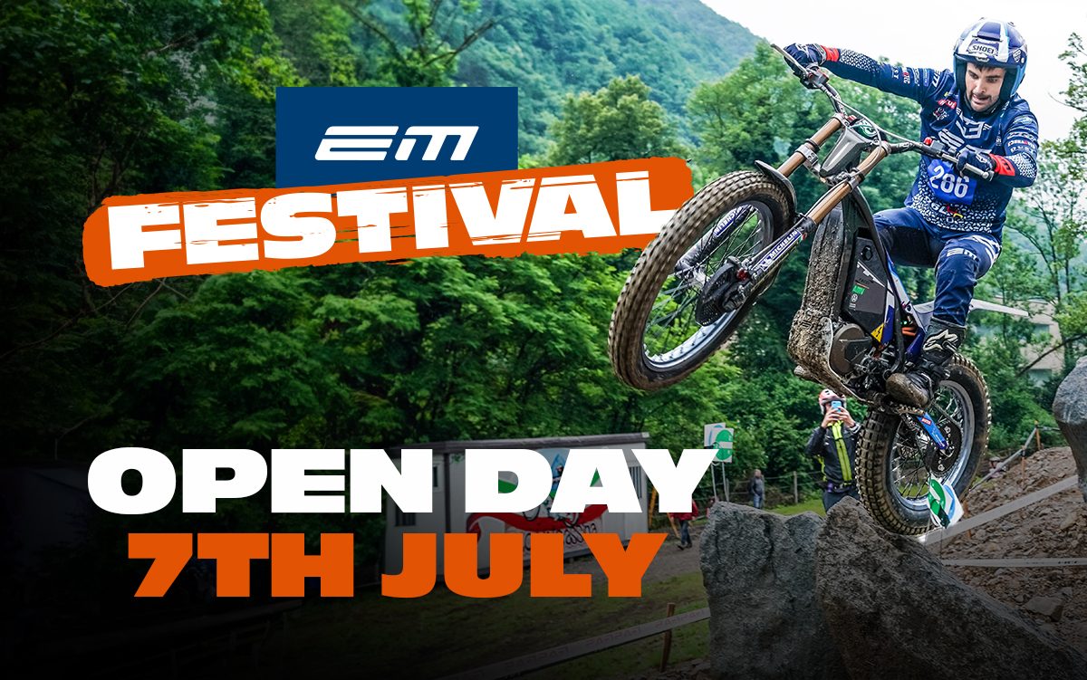 a man flying through the air while riding a bike down a dirt road