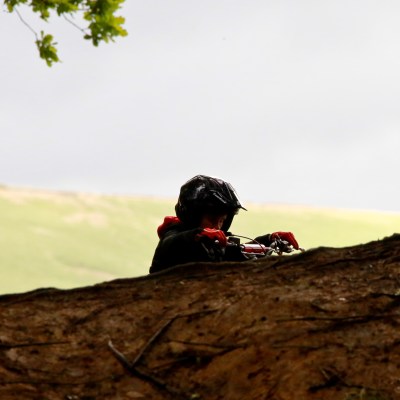 a person sitting on a rocky hill