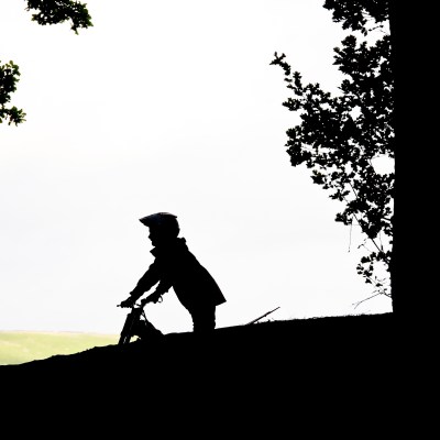 a man riding a skateboard up the side of a hill