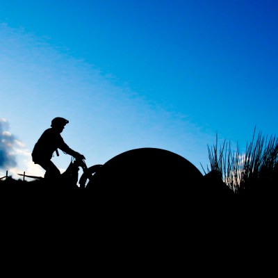 a silhouette of a hill