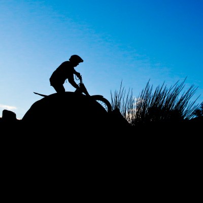a man riding on top of a hill
