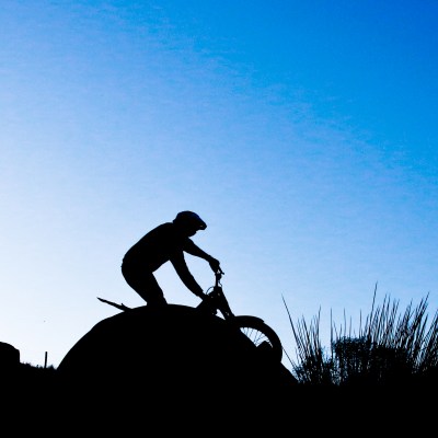 a man riding on top of a hill