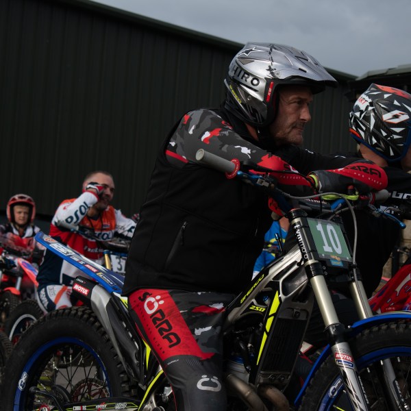 a man riding on the back of a motorcycle