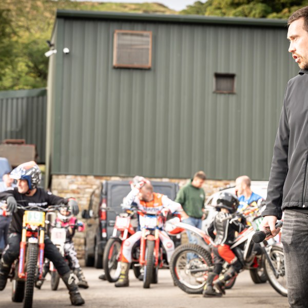 a group of people riding on the back of a motorcycle