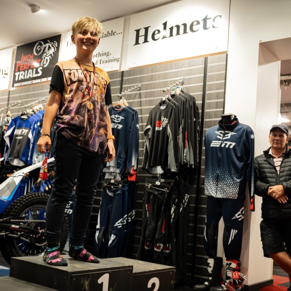 a group of people standing in front of a store
