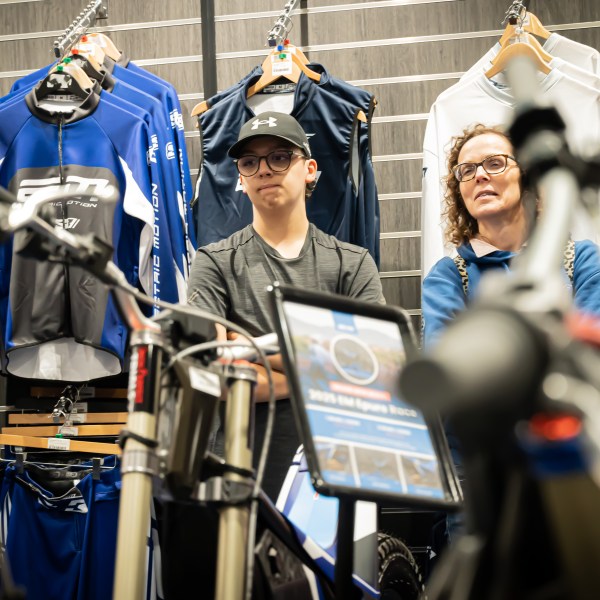 Julia Solomonoff et al. standing in front of a building