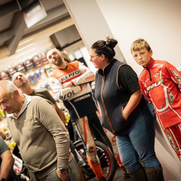 a group of people standing in front of a store