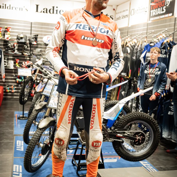 a man riding a motorcycle on display
