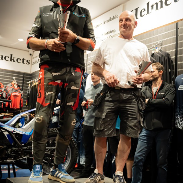 a group of people standing around a plane